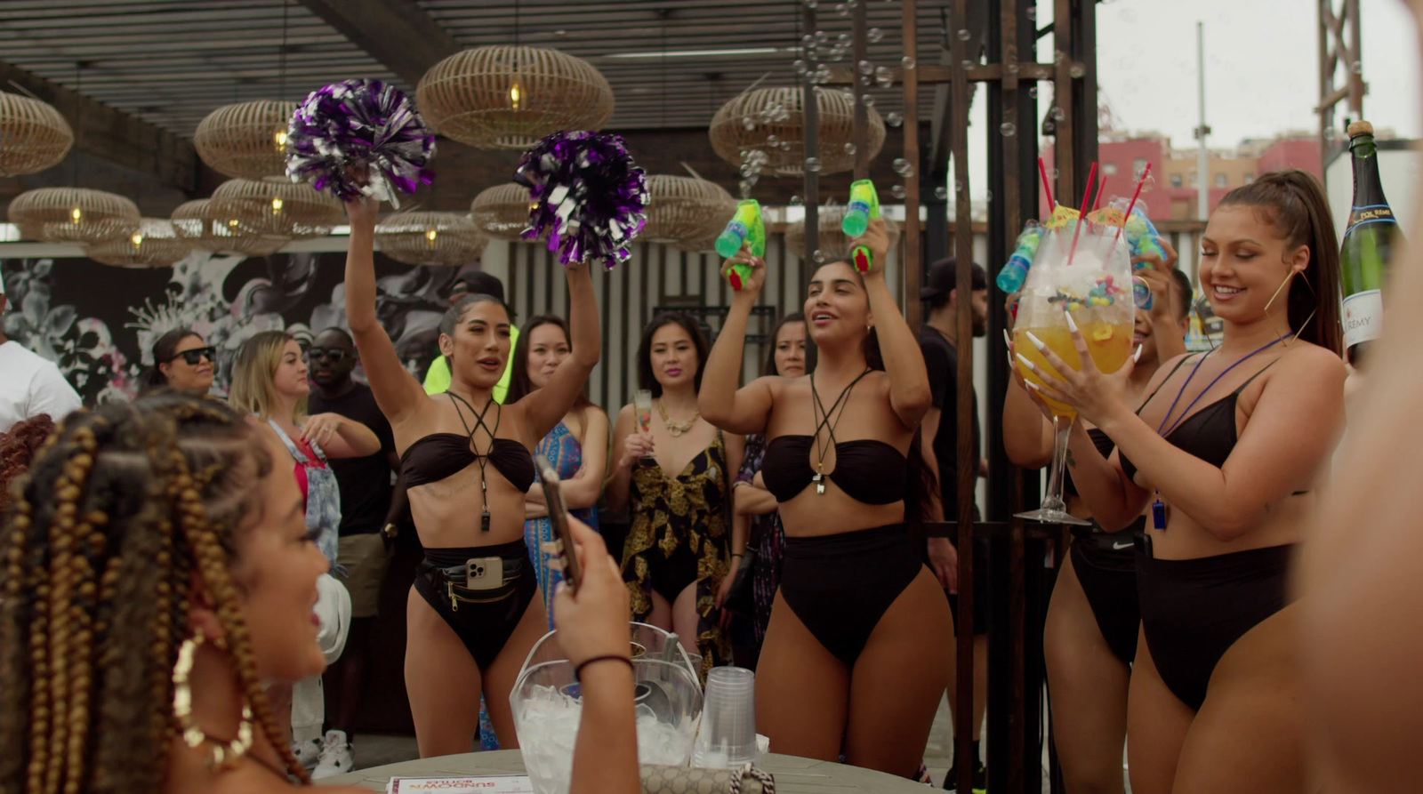 a group of women standing around each other