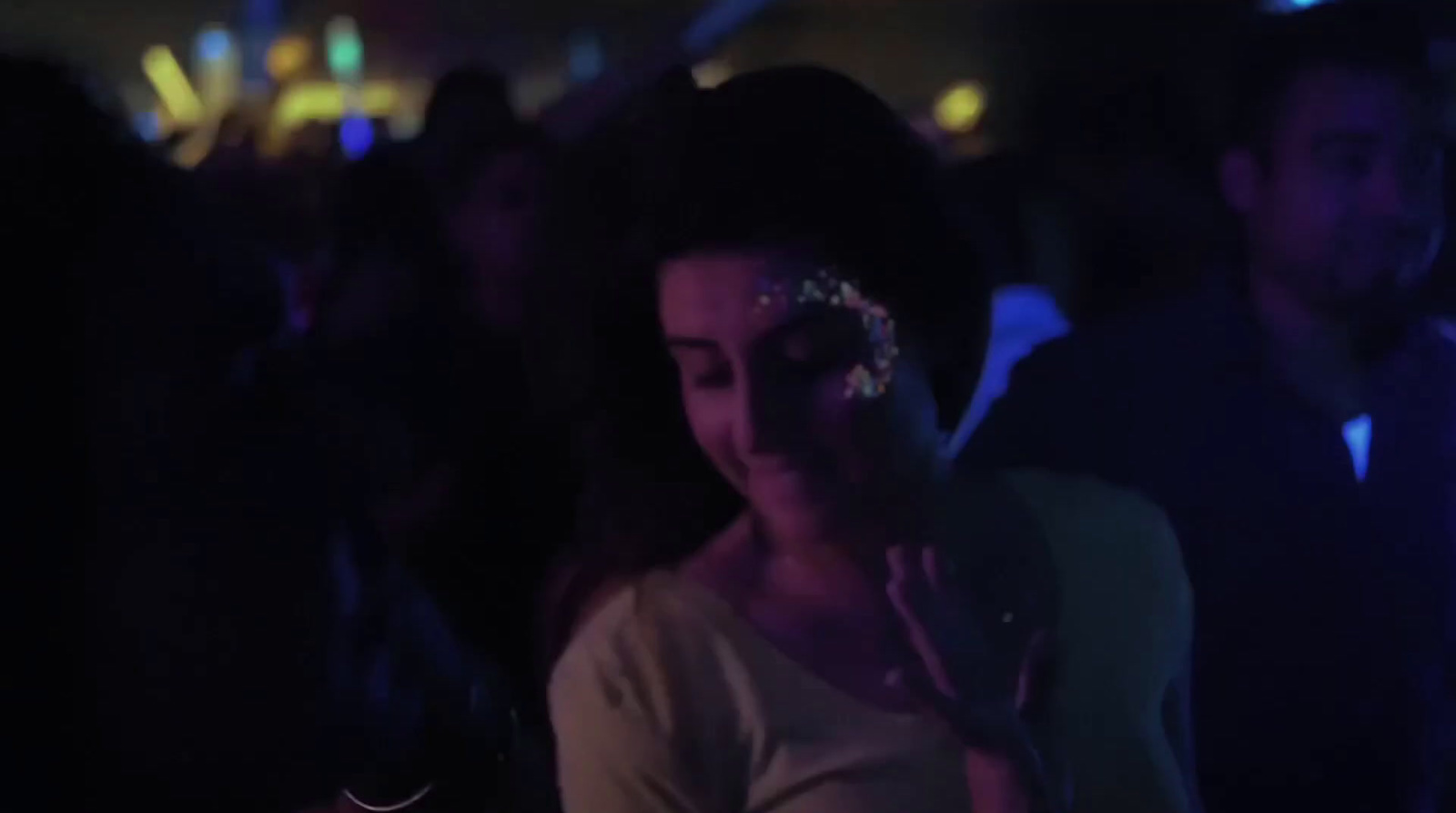 a woman wearing a head piece in a crowd