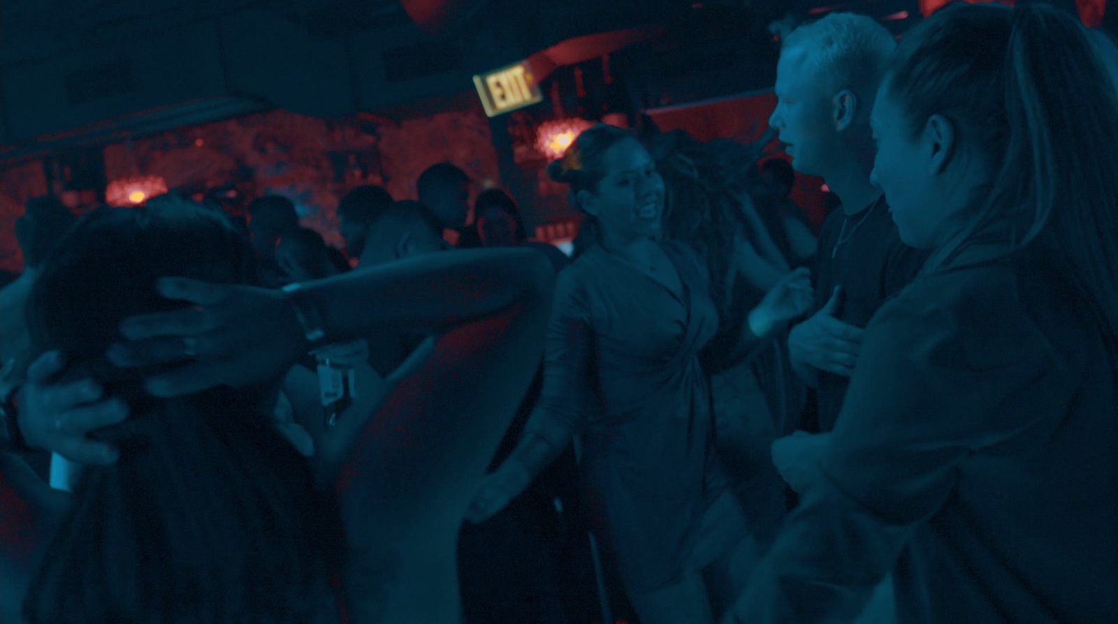 a group of people dancing at a party