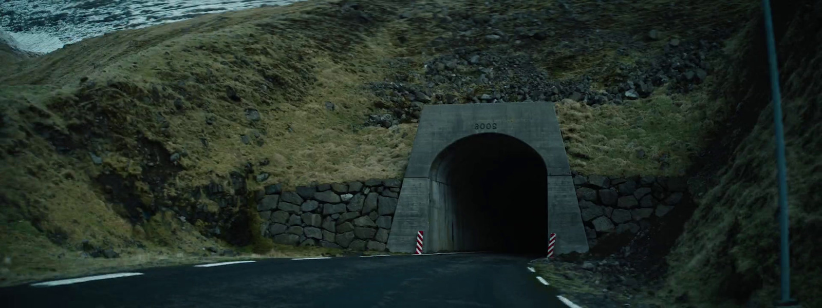 a tunnel leading to a mountain in iceland