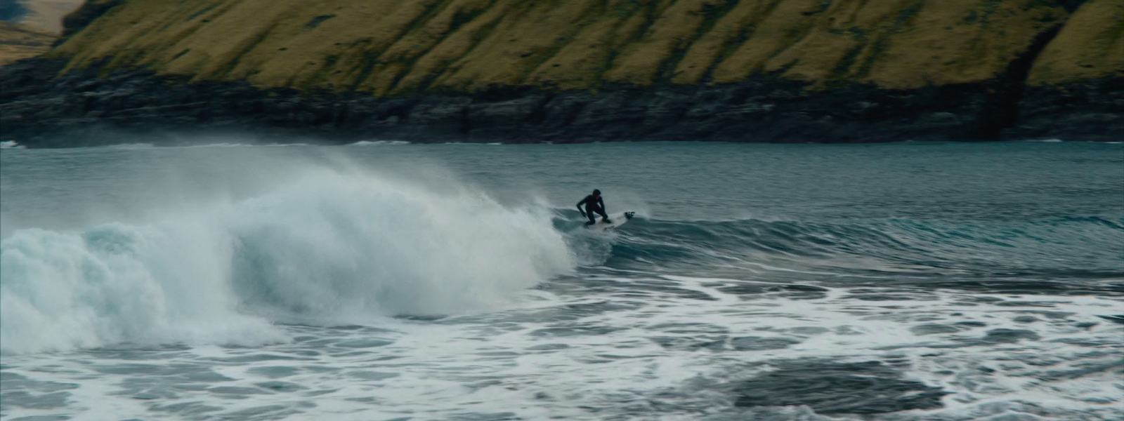 a surfer riding a wave in the ocean