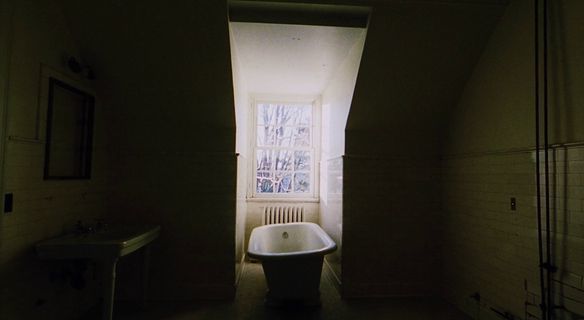 a bathroom with a bathtub and a window