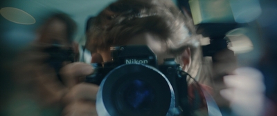 a person taking a picture with a camera