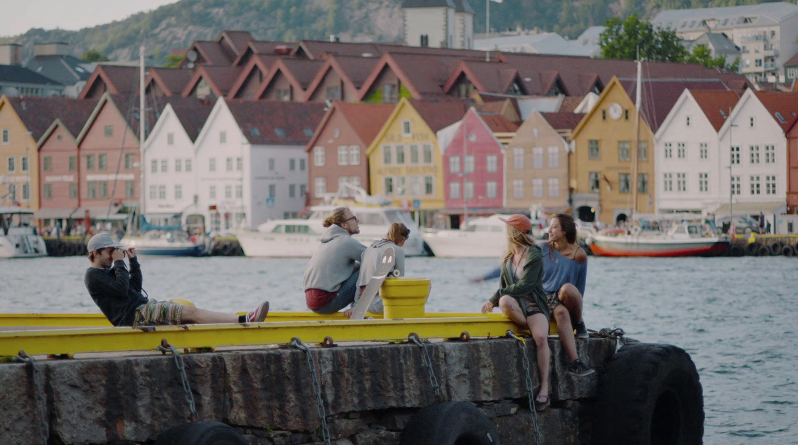 a group of people sitting on a yellow boat