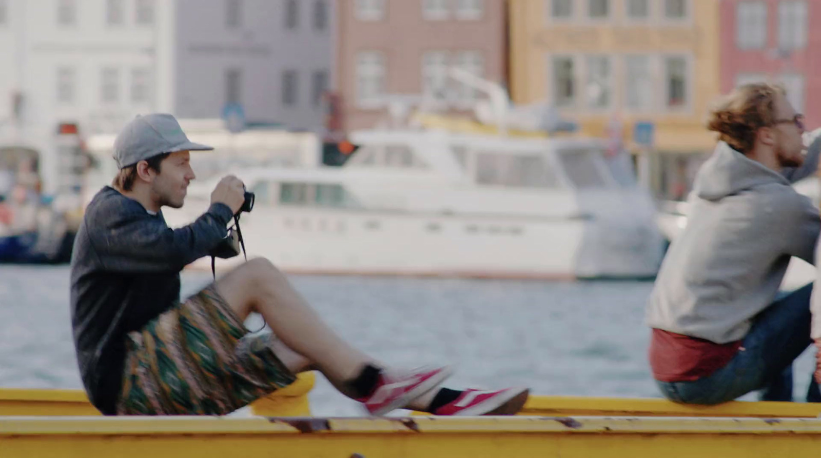 a group of people sitting on a yellow boat