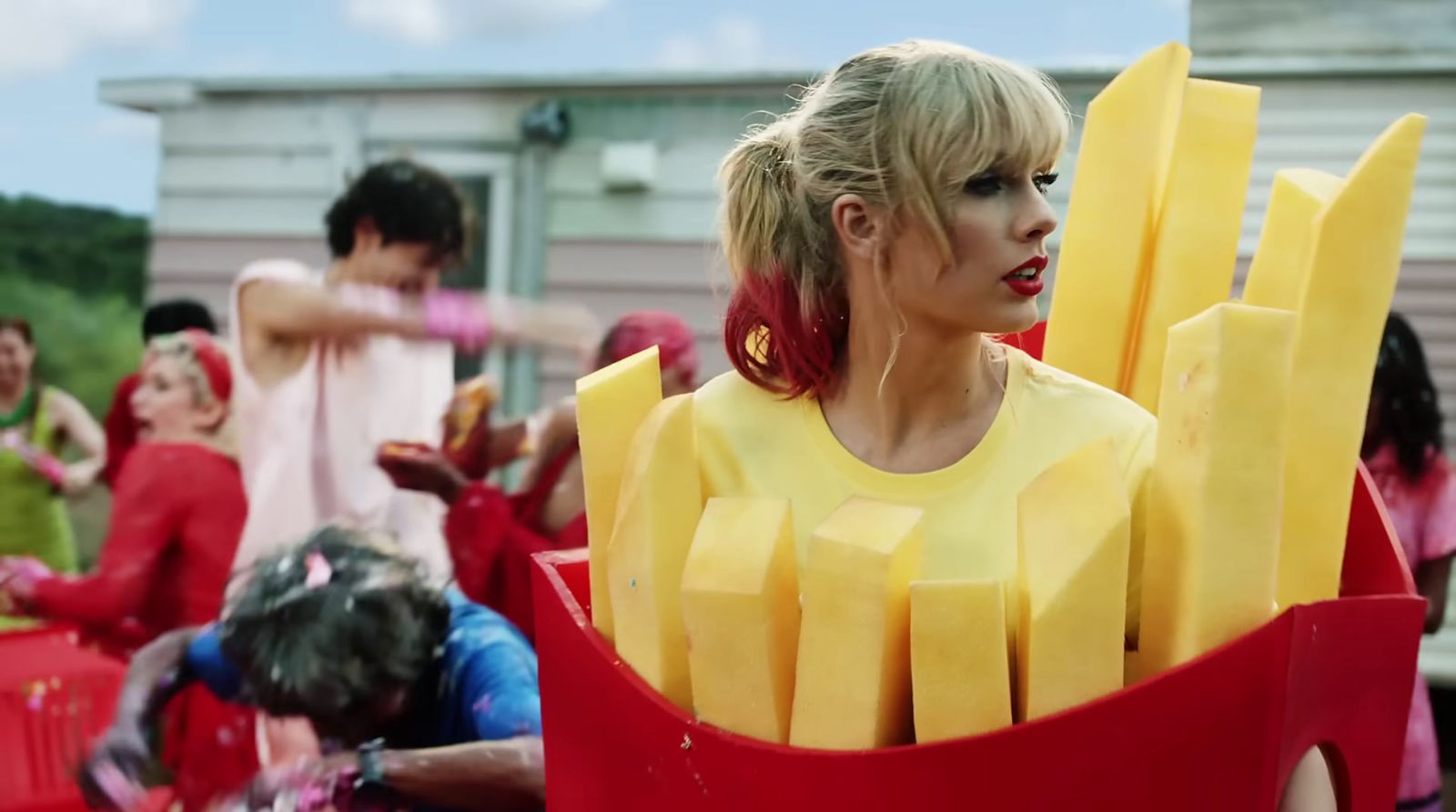 a woman in a costume made of cheese sticks