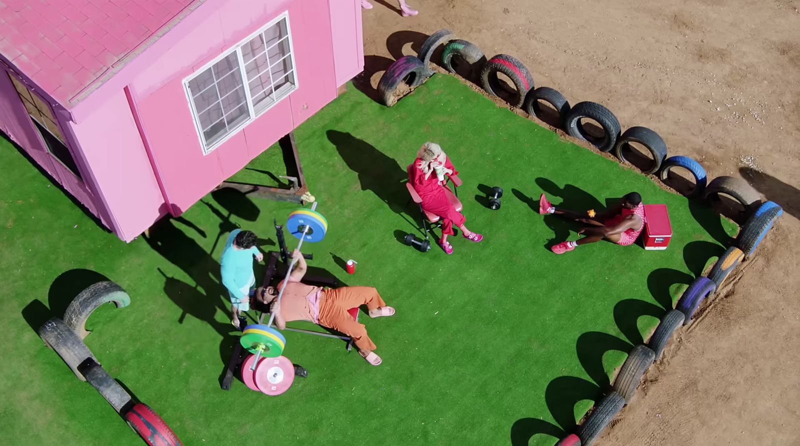 a group of children playing on a fake lawn