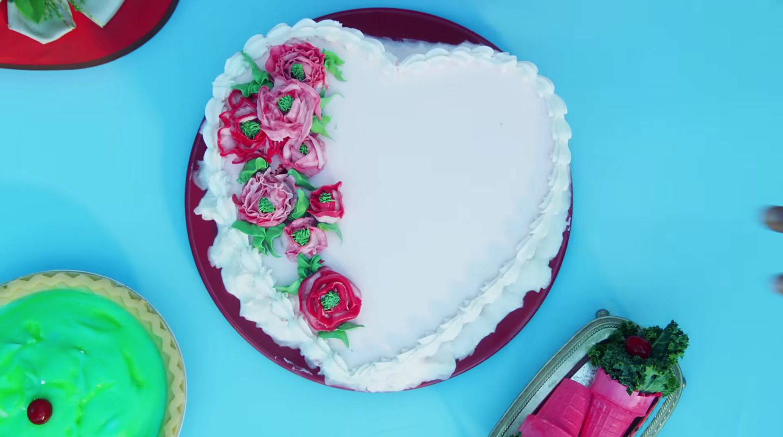 a heart shaped cake with flowers on it