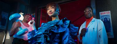 a group of three women standing next to each other