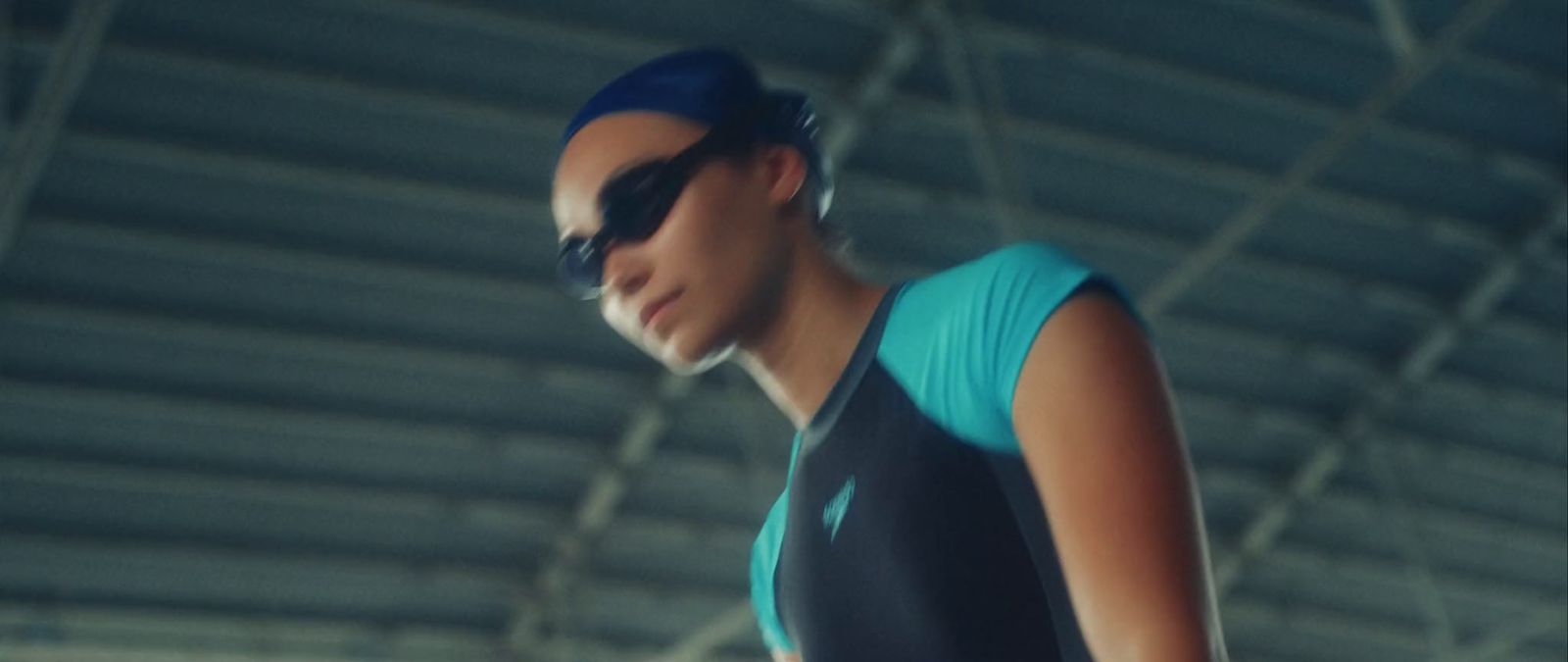 a woman in a swimming suit and goggles