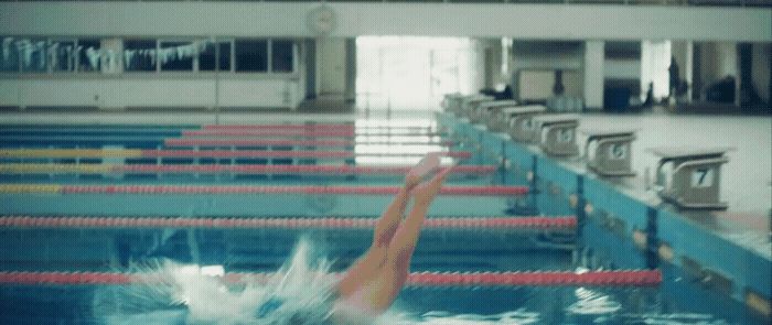 a person swimming in a swimming pool