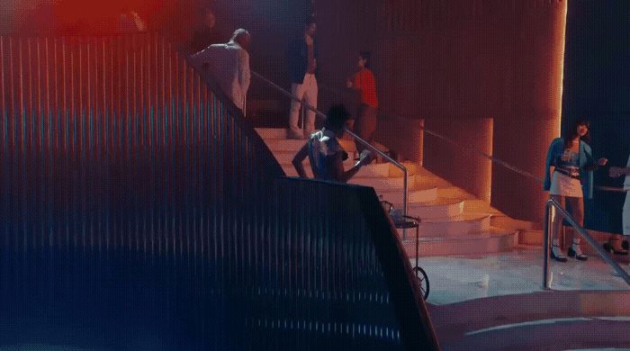 a group of people standing on a set of stairs