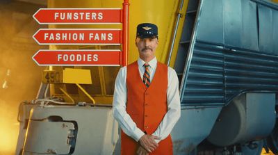 a man standing in front of a train