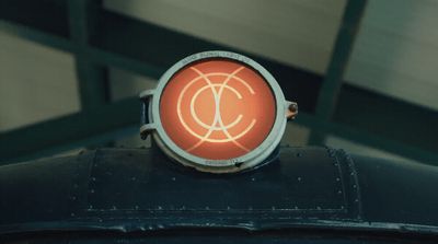 a close up of a red light on a metal object