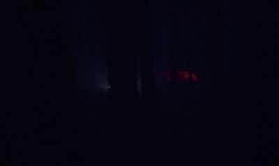 a blurry image of a red object in the dark