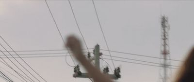 a blurry photo of a person holding their hand up