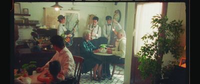 a group of people sitting around a table in a room