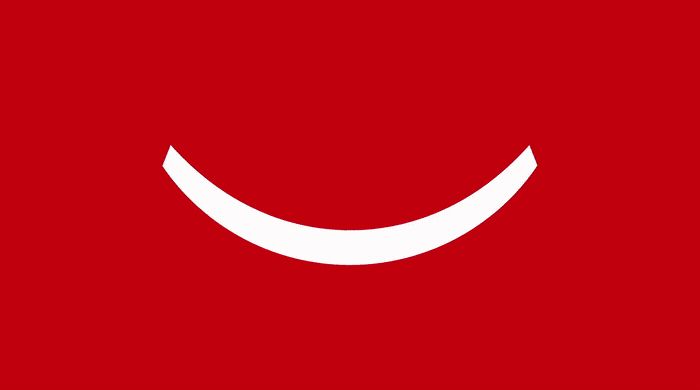 a red background with a white smiley face