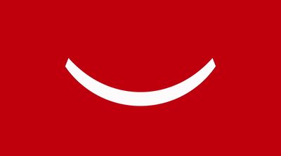 a red background with a white smiley face