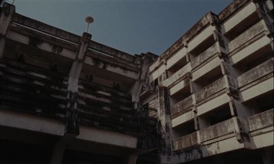 an old building with balconies and a street light