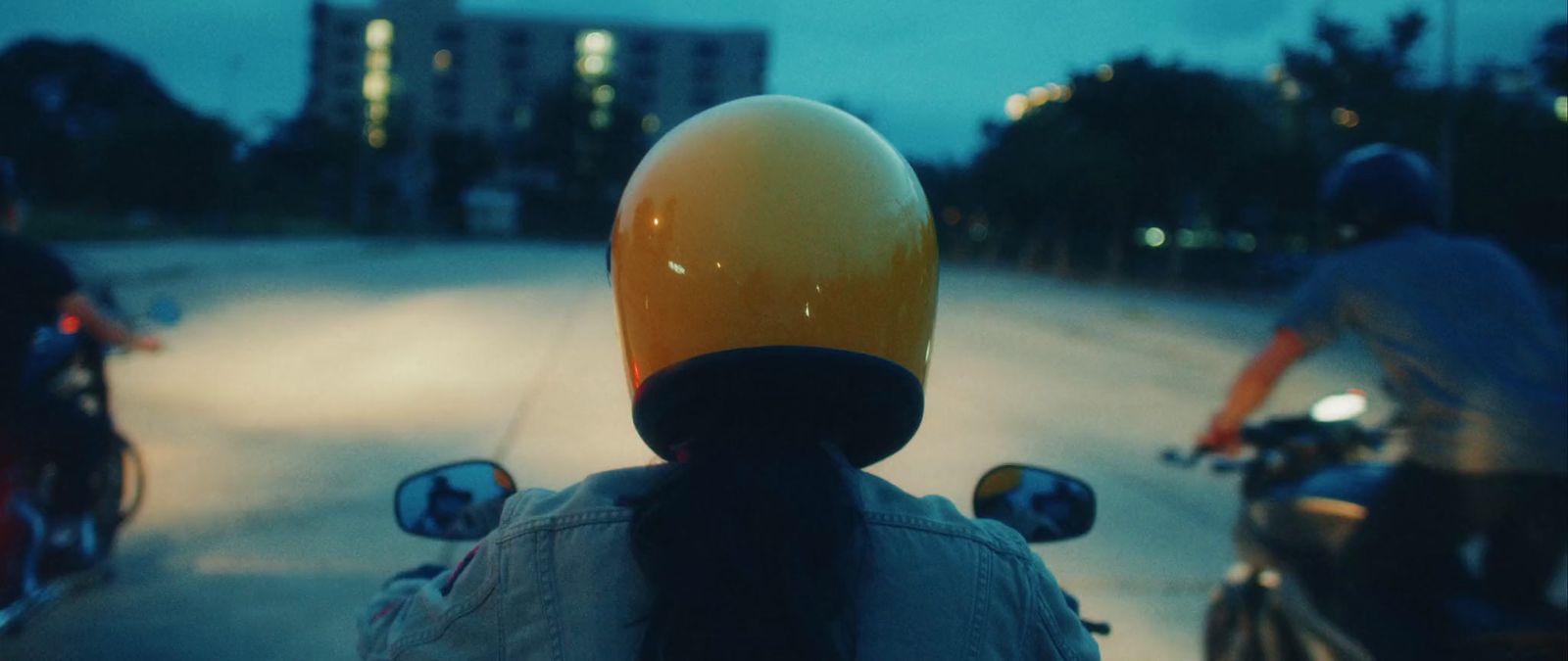 a person riding a motorcycle with a helmet on