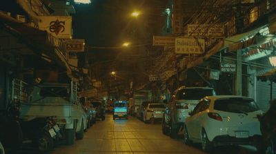 a city street filled with lots of parked cars