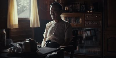 a man sitting in a chair in a room