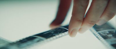 a close up of a person holding a remote control