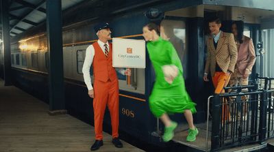 a group of people standing on a train platform