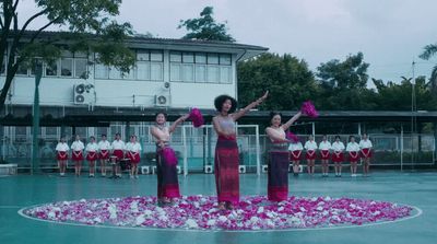 a group of women standing on top of a tennis court