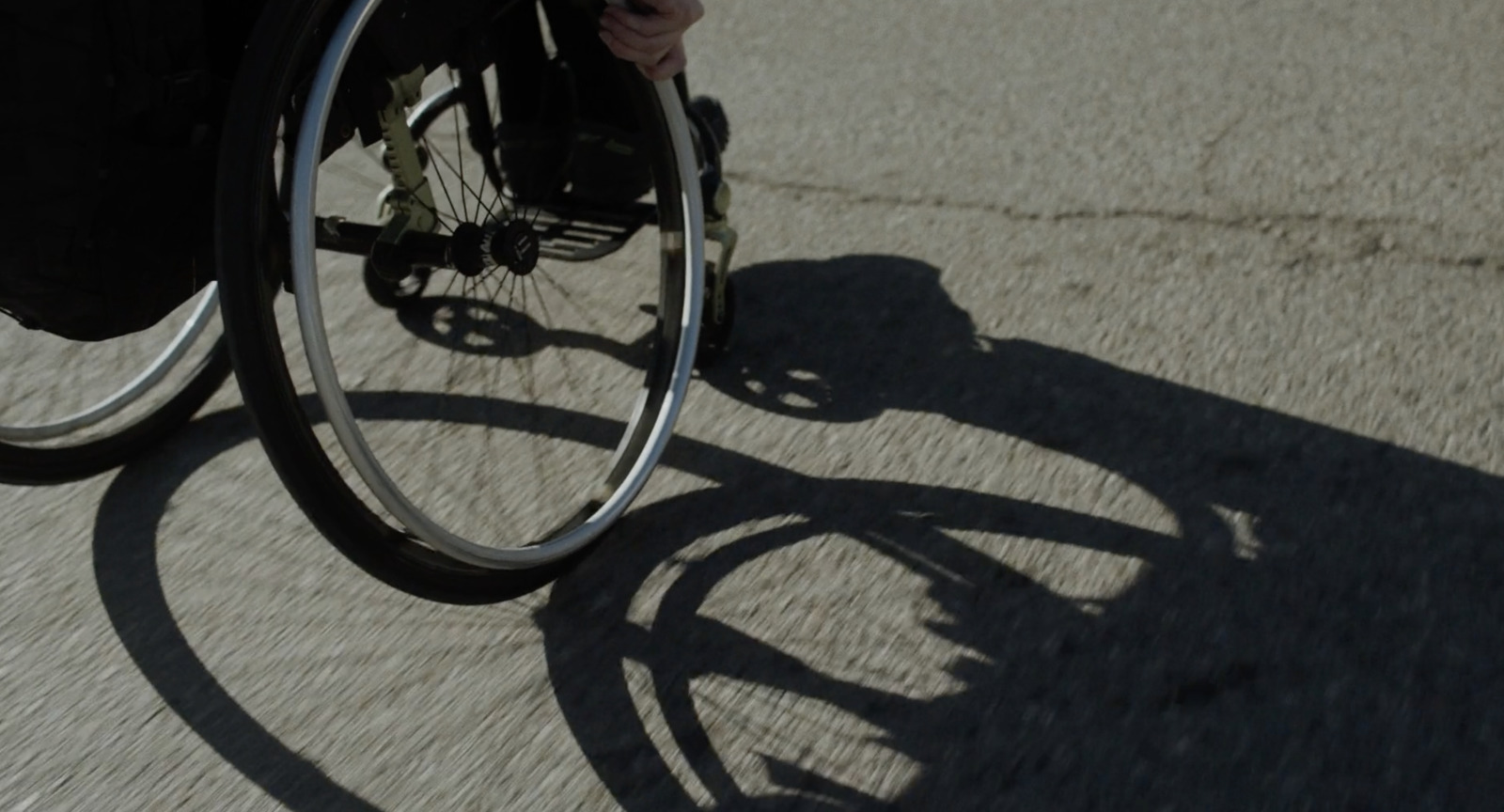 a person riding a bike down a street