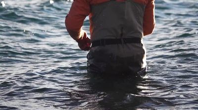 a man standing in a body of water