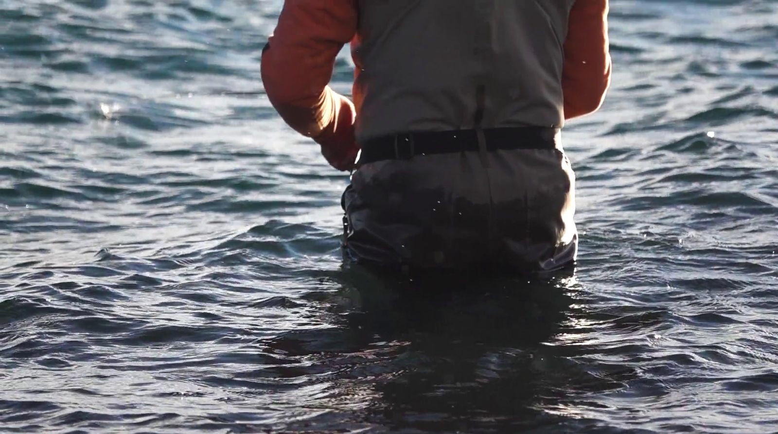 a man standing in a body of water