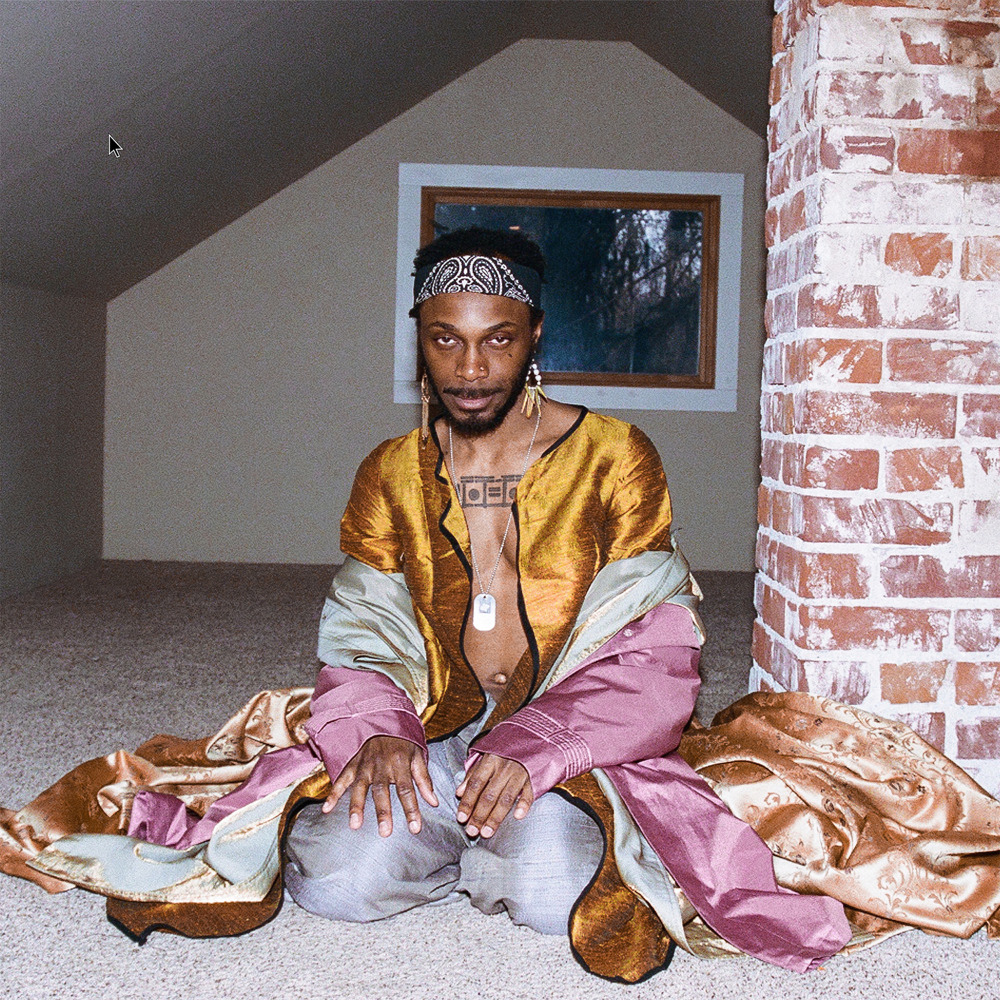 a man sitting on the floor in a room