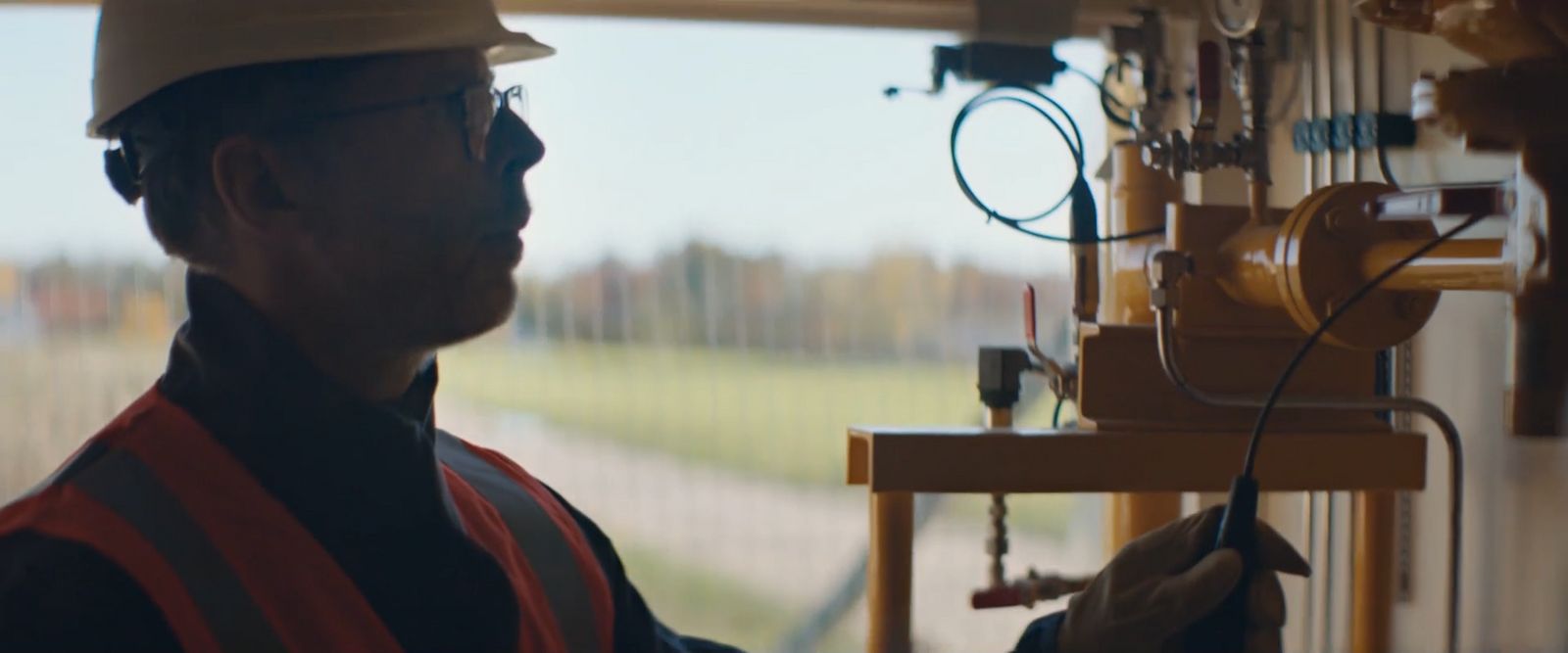 a man wearing a hard hat and safety vest