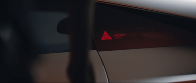 a red triangle sticker on the side of a car