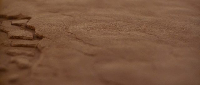 a close up of a person's footprints in the sand