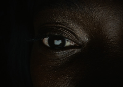 a close up of a person's eye in the dark