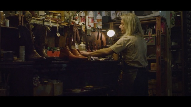 a man standing at a counter in a store