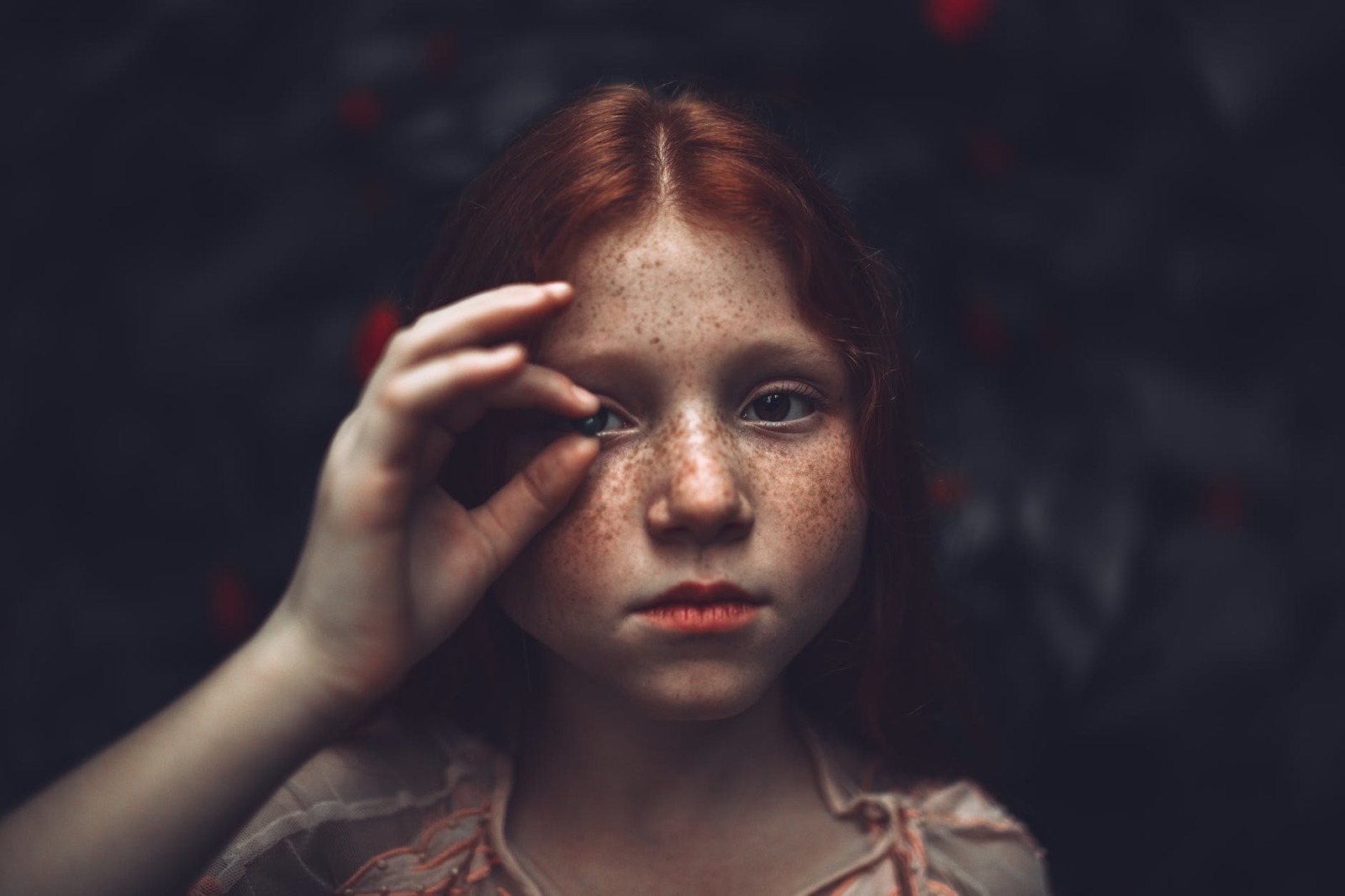 a young girl with freckles on her face