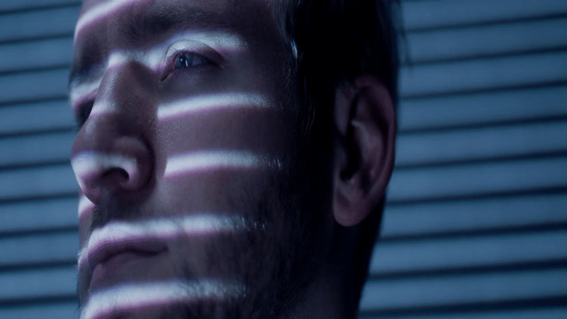 a man with his face painted with white lines