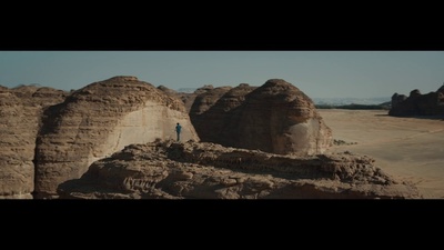 a person standing on top of a rock formation