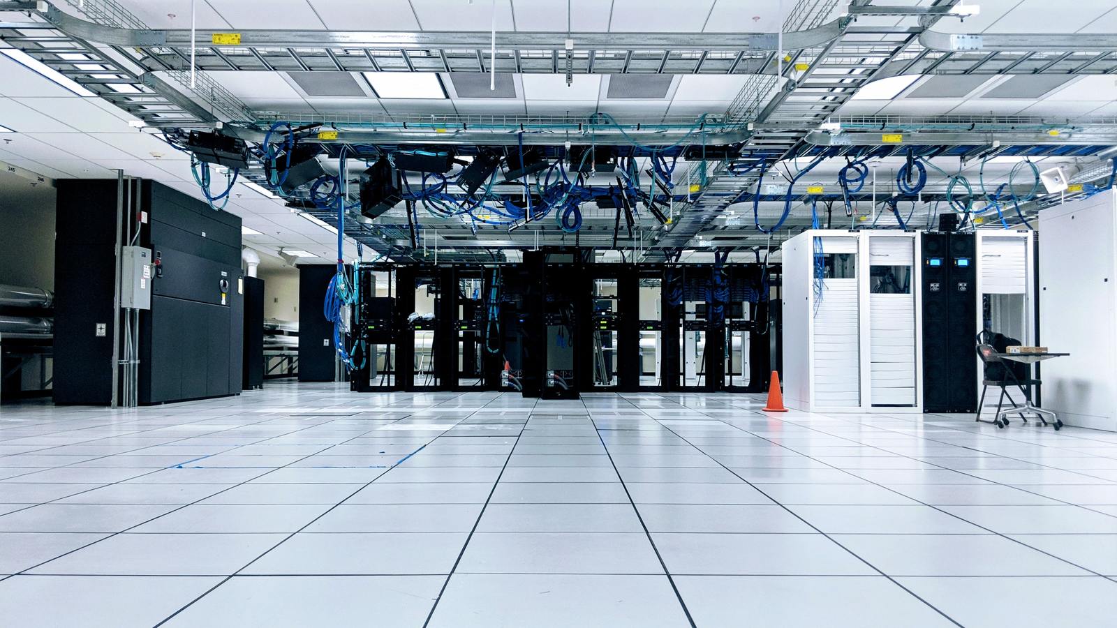 a large room with a bunch of wires hanging from the ceiling