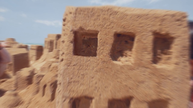 a sand sculpture of a building made out of sand