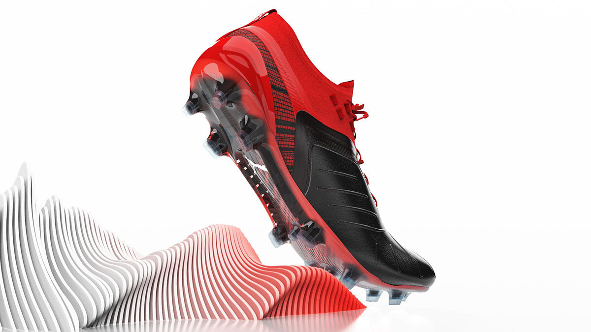 a pair of black and red soccer cleats