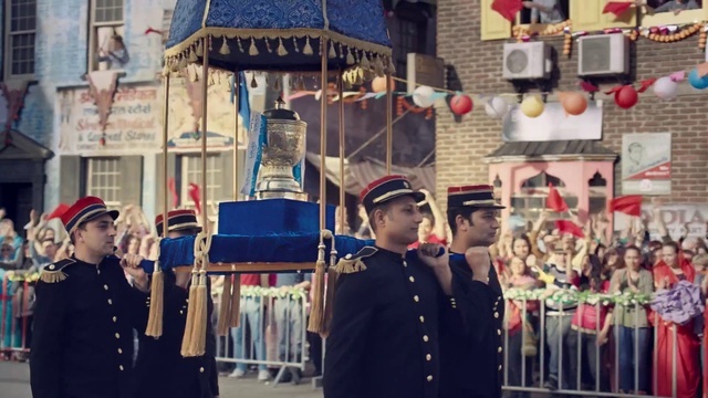 a group of men in uniform marching down a street