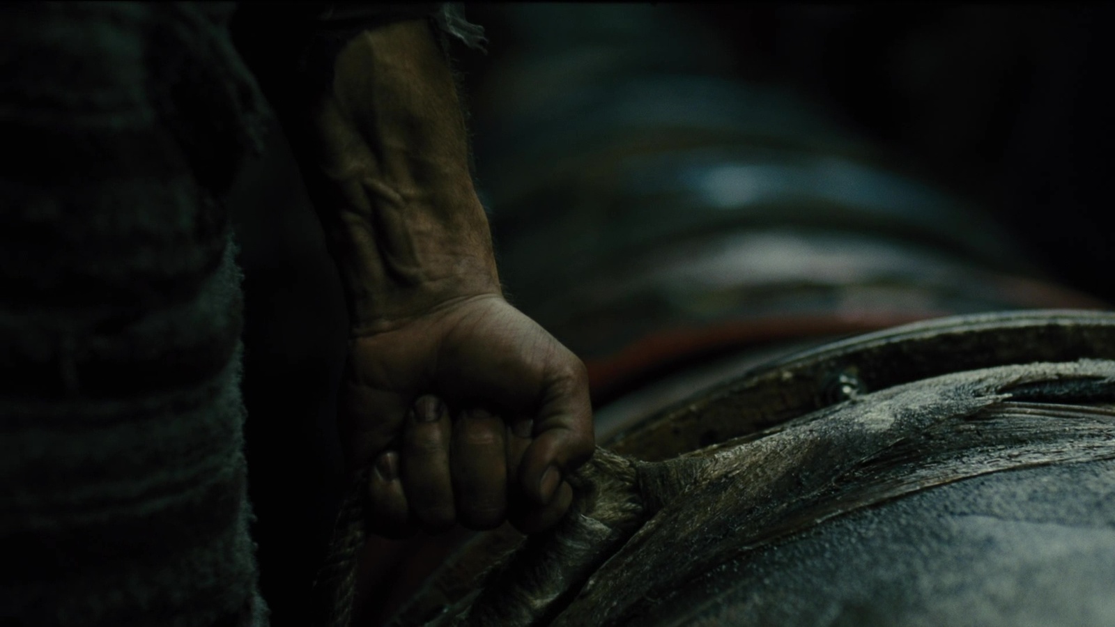 a person holding onto a large piece of wood