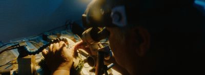 a man working on a bicycle in a room