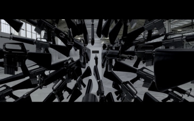 a bunch of guns that are in a room