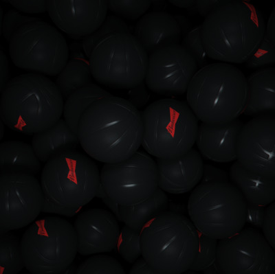 a pile of black balls with red arrows on them